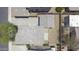 This aerial view shows a home with gravel landscaping, a paved driveway, and well-maintained roof at 7227 E Northridge St, Mesa, AZ 85207