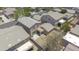 An aerial shot displays a home with a tidy backyard, patio space, and neutral-toned exterior at 7227 E Northridge St, Mesa, AZ 85207