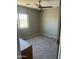 Neutral bedroom with a carpeted floor, window, and ceiling fan at 7227 E Northridge St, Mesa, AZ 85207