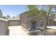 Inviting two-story home with a tile roof, a well-maintained lawn, a large tree, and an attached garage at 7227 E Northridge St, Mesa, AZ 85207