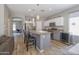 Spacious kitchen featuring stainless steel appliances, a wine cooler, and breakfast bar seating at 7227 E Northridge St, Mesa, AZ 85207