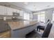 Bright kitchen features a large island, stainless steel appliances, and stylish pendant lighting at 7227 E Northridge St, Mesa, AZ 85207