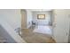 Inviting room with an accent rug, artwork, wood-look floors, and a bright window at 7227 E Northridge St, Mesa, AZ 85207