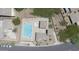 Aerial view showcasing a community pool with lounge chairs, cabanas, and lush landscaping at 7227 E Northridge St, Mesa, AZ 85207