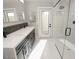 Modern bathroom with dual sinks, a walk-in shower, and stylish fixtures at 7840 N 7Th St # 15, Phoenix, AZ 85020