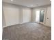 Large bedroom boasts neutral walls and carpet, sliding glass door, plus two large doors for a closet at 7840 N 7Th St # 15, Phoenix, AZ 85020