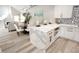 Open-concept kitchen with island seating, marble counters and stainless appliances at 7840 N 7Th St # 15, Phoenix, AZ 85020