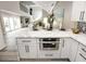 Modern kitchen featuring marble countertops, white cabinets, and stainless steel appliances at 7840 N 7Th St # 15, Phoenix, AZ 85020