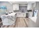 Modern kitchen with marble countertops, white cabinets, and stainless steel appliances at 7840 N 7Th St # 15, Phoenix, AZ 85020