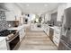 Bright, white kitchen featuring stainless steel appliances and a modern backsplash at 7840 N 7Th St # 15, Phoenix, AZ 85020