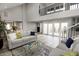 Open-concept living room with plenty of natural light, stylish furniture, and wood floors at 7840 N 7Th St # 15, Phoenix, AZ 85020