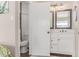 Bright bathroom featuring a white vanity with modern fixtures and a mirrored cabinet at 925 W Hudson Way, Gilbert, AZ 85233