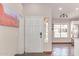 Entryway featuring a white front door, neutral walls, and a peek into the kitchen at 925 W Hudson Way, Gilbert, AZ 85233