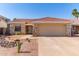 Inviting single-Gathering home with a well-kept lawn, desert landscaping, and a two-car garage at 925 W Hudson Way, Gilbert, AZ 85233