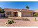 Charming home featuring desert landscaping, a red-tile roof, and a two-car garage at 925 W Hudson Way, Gilbert, AZ 85233