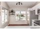 Kitchen with stainless appliances and large windows offering neighborhood views and natural light at 925 W Hudson Way, Gilbert, AZ 85233