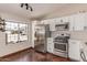 Bright kitchen featuring stainless steel appliances, white cabinets, and a window view at 925 W Hudson Way, Gilbert, AZ 85233