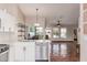 Open floor plan showcases kitchen island with stainless steel dishwasher, sink and expansive views of the living area at 925 W Hudson Way, Gilbert, AZ 85233