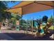 Community playground with colorful slides and play structures, providing a fun and safe area for children at 925 W Hudson Way, Gilbert, AZ 85233