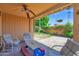Covered back patio offering space for outdoor dining and relaxation overlooking landscaped yard at 1040 E Clinton St, Phoenix, AZ 85020