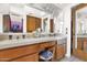 Bathroom vanity featuring double sinks, updated countertops, and a makeup station area at 1040 E Clinton St, Phoenix, AZ 85020