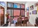 Charming dining room featuring a large window with natural light, decorative accents, and comfortable seating at 1040 E Clinton St, Phoenix, AZ 85020