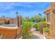 Inviting front entrance showing lush desert landscaping, tile accents, and partial view of the architecture at 1040 E Clinton St, Phoenix, AZ 85020