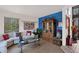 Stylish living room with modern furnishings, colorful wall art, and tile floors at 1040 E Clinton St, Phoenix, AZ 85020