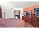 Comfortable main bedroom with a built-in vanity, and a light peach accent wall at 1040 E Clinton St, Phoenix, AZ 85020