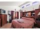 Spacious main bedroom with lots of natural light, a built-in bookshelf, and a private balcony at 1040 E Clinton St, Phoenix, AZ 85020