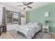 Bright bedroom with a queen-size bed and a window offering natural light at 10852 E Contessa St, Mesa, AZ 85207