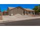 Charming single-story home featuring a well-maintained front yard, two-car garage, and inviting curb appeal at 10852 E Contessa St, Mesa, AZ 85207