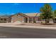 Charming single-story home featuring a well-maintained front yard, two-car garage, and inviting curb appeal at 10852 E Contessa St, Mesa, AZ 85207