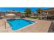Backyard pool with patio area, lawn, shed, and seating, perfect for enjoying sunny days at 10852 E Contessa St, Mesa, AZ 85207