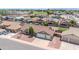 Overhead shot of a well-maintained home with a spacious three-car garage in a quiet neighborhood at 10943 W Alice Ave, Peoria, AZ 85345
