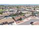 Aerial view showcases a home with a private backyard swimming pool and lush landscaping at 10943 W Alice Ave, Peoria, AZ 85345