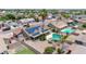 Aerial view of a house with a pool and solar panels in a residential area at 10943 W Alice Ave, Peoria, AZ 85345