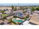 Aerial view of a home with a backyard pool and solar panels in a suburban community at 10943 W Alice Ave, Peoria, AZ 85345