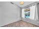 Bedroom with tile floor and view of the backyard pool at 10943 W Alice Ave, Peoria, AZ 85345