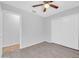 Neutral bedroom with wood flooring, a ceiling fan and a large closet at 10943 W Alice Ave, Peoria, AZ 85345