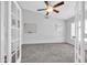Spacious bedroom with vaulted ceiling, ceiling fan and light gray carpet at 10943 W Alice Ave, Peoria, AZ 85345