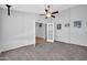 Carpeted room with french doors provides flexible space for an office or den at 10943 W Alice Ave, Peoria, AZ 85345