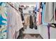 Walk-in closet features built-in shelving and ample storage space at 10943 W Alice Ave, Peoria, AZ 85345