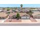 Charming single-story home with a three-car garage, well-maintained landscaping, and inviting curb appeal at 10943 W Alice Ave, Peoria, AZ 85345