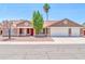 Charming single-story home with a well-manicured front yard and a spacious three-car garage at 10943 W Alice Ave, Peoria, AZ 85345