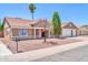 Charming single-story home with well-maintained landscaping, showcasing curb appeal at 10943 W Alice Ave, Peoria, AZ 85345
