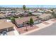 Well-kept home with a three-car garage, mature trees, and neatly landscaped front yard at 10943 W Alice Ave, Peoria, AZ 85345