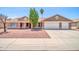 Charming single story home with a 2-car garage, desert landscaping, and a well-maintained front yard at 10943 W Alice Ave, Peoria, AZ 85345
