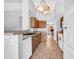 Traditional-style kitchen includes wood cabinets and tile flooring at 10943 W Alice Ave, Peoria, AZ 85345