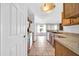 Bright kitchen features wood cabinets and tile flooring with an open concept design at 10943 W Alice Ave, Peoria, AZ 85345